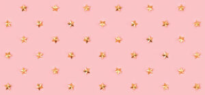 Gold star pattern on pink background