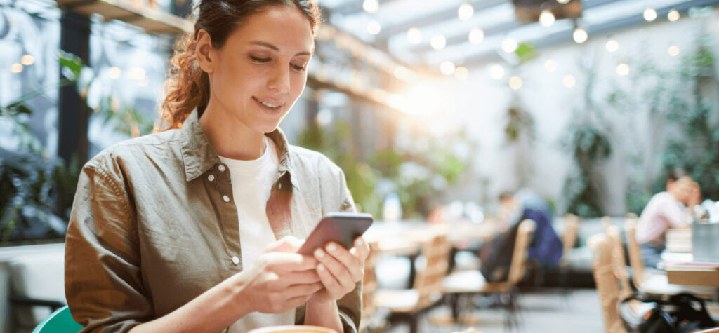 Person on phone in outdoor setting