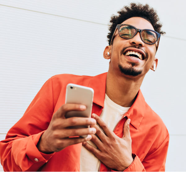 person smiling at message they received