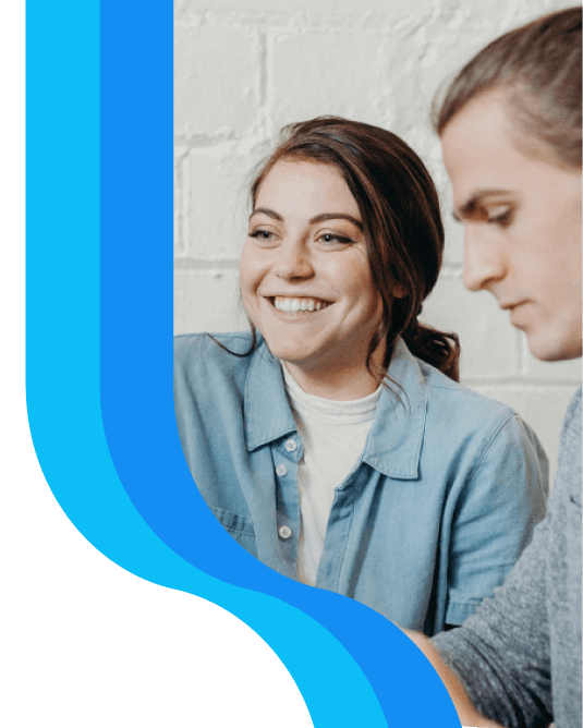 Person smiling working with a team member