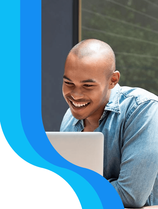 Person smiling on laptop